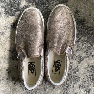 Gold Vans slip-on sneakers